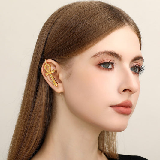 Ankh ear cuff worn on the ear, profile view