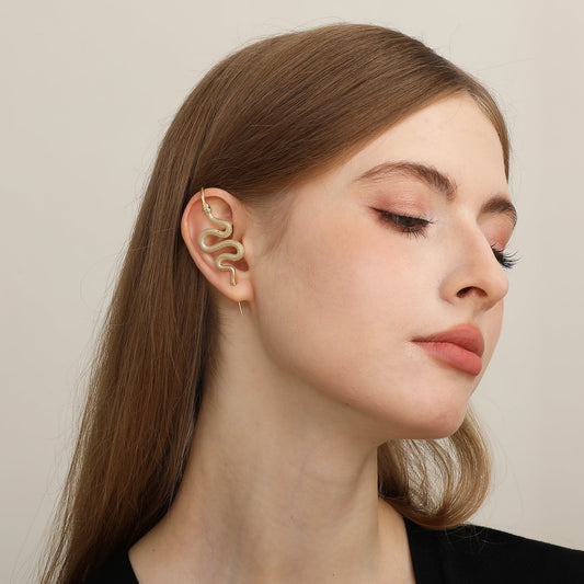 Serpent ear cuff worn on the ear, profile view
