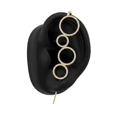 Linked Circles ear cuff in gold on a black ear form