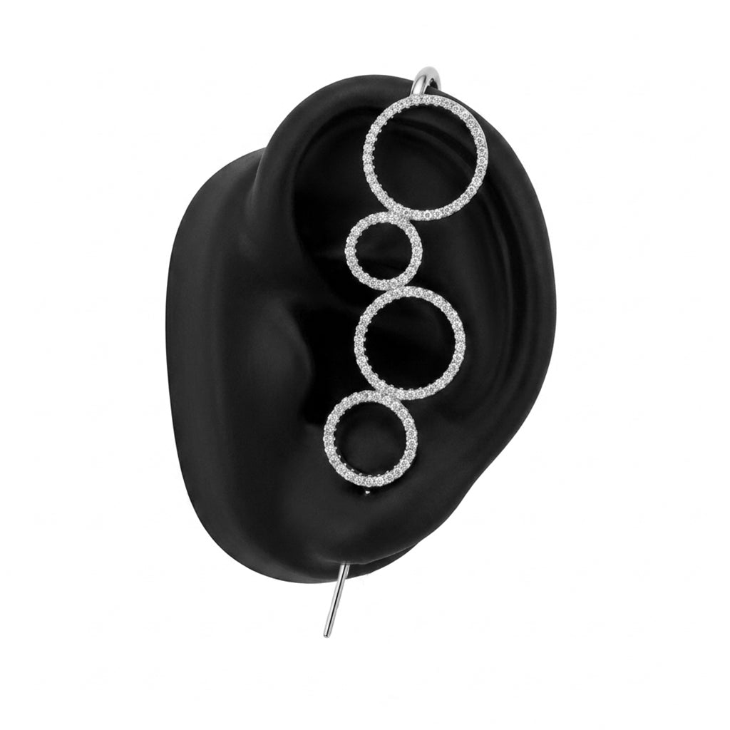Linked Circles ear cuff in silver on a black ear form