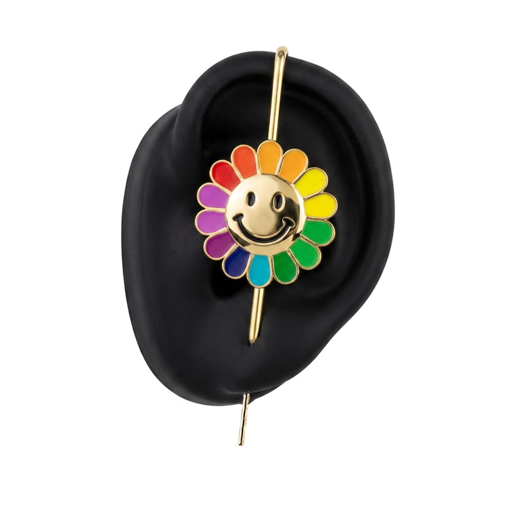 Rainbow Flower ear cuff in gold on a black ear form