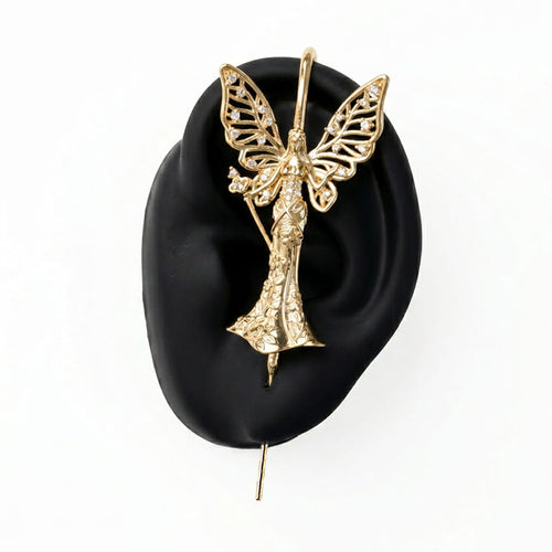 Forrest Fairy ear cuff in gold on a black ear form