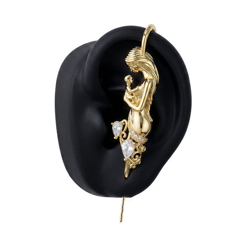 Motherhood ear cuff in gold on a black ear form