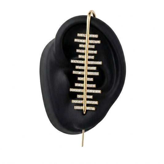 Balance ear cuff in gold on a black ear form