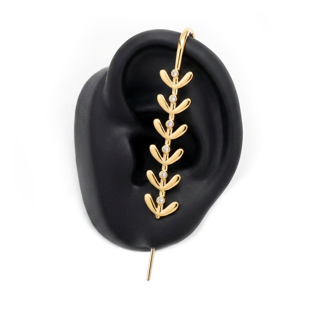 Flora ear cuff in gold on a black ear form