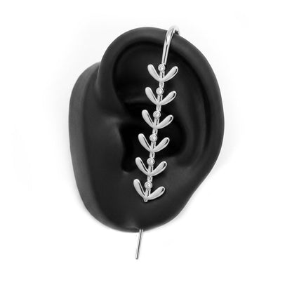 Flora ear cuff in silver on a black ear form