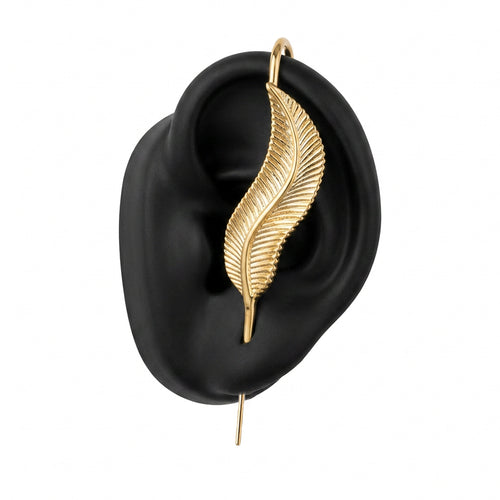 Feathered Grace ear cuff in gold on a black ear form
