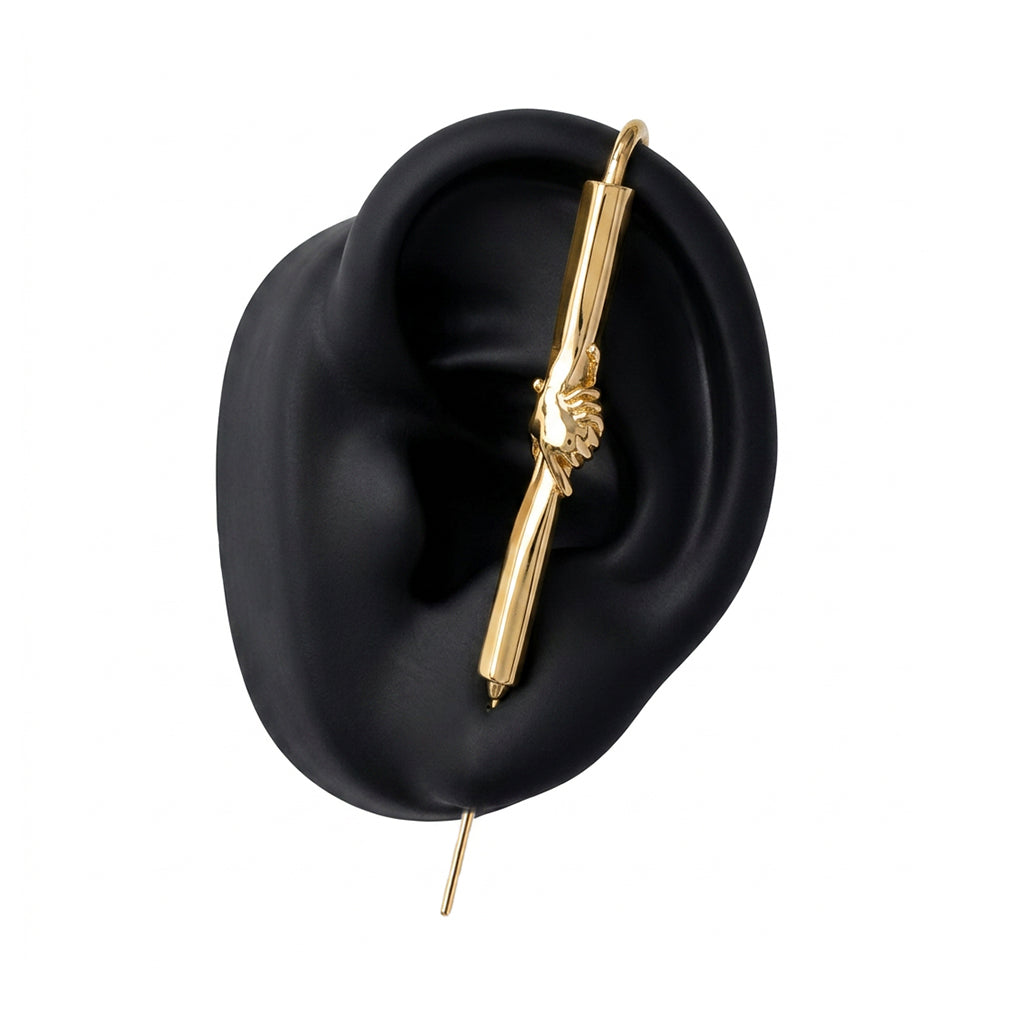 Helping Hand ear cuff in gold on a black ear form