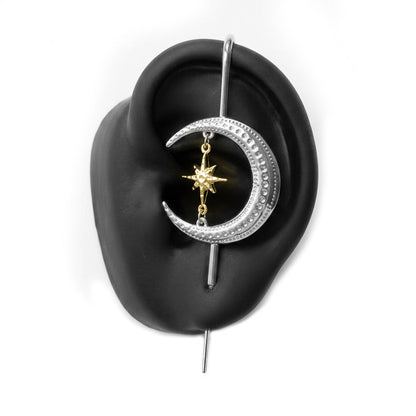 Cosmic Connection ear cuff in silver on a black ear form