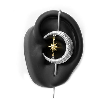 Cosmic Connection ear cuff in silver on a black ear form