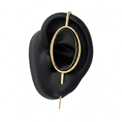 Halo ear cuff in gold on a black ear form