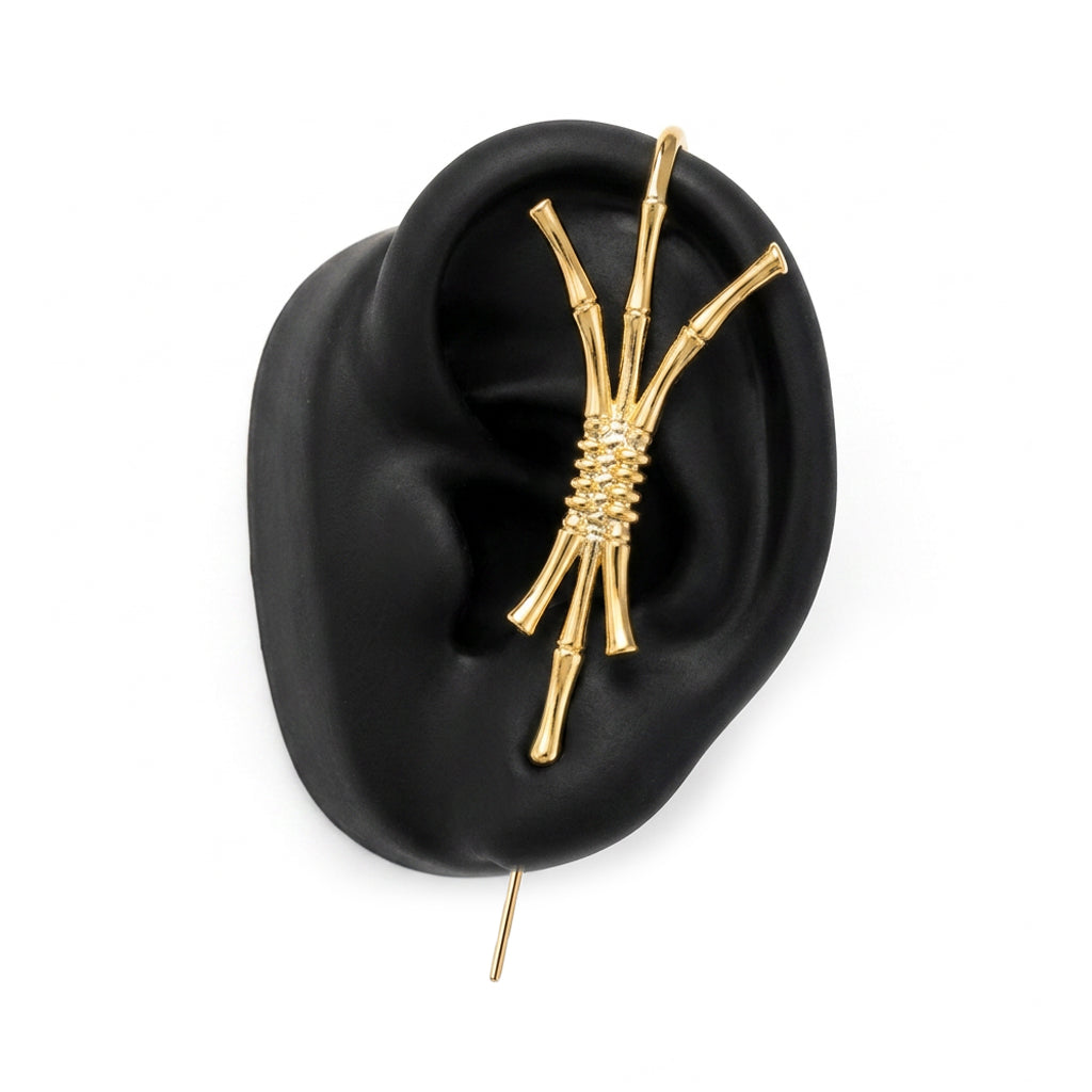 Ward of Protection ear cuff in gold on a black ear form