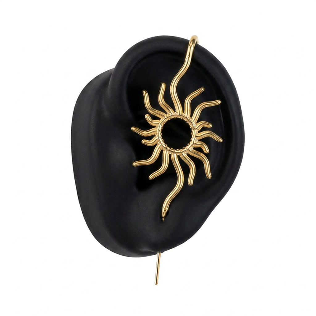 Sunfire ear cuff in gold on a black ear form