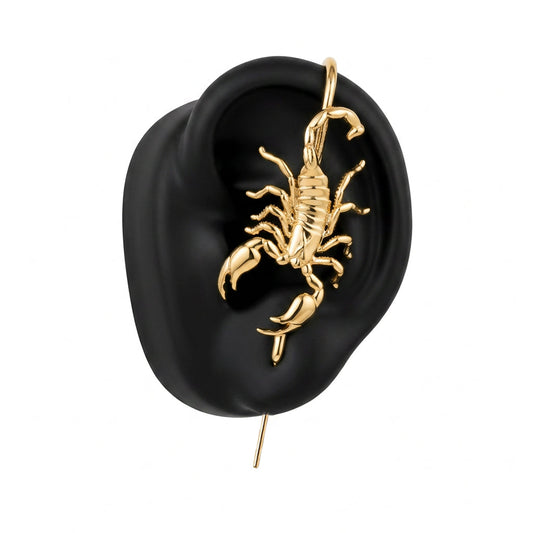 Fierce Scorpion ear cuff in gold on a black ear form