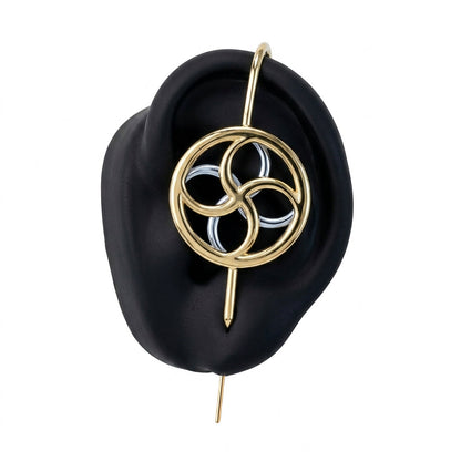 Kinetic Loop ear cuff in gold on a black ear form
