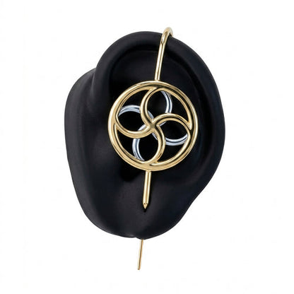 Kinetic Loop ear cuff in gold on a black ear form