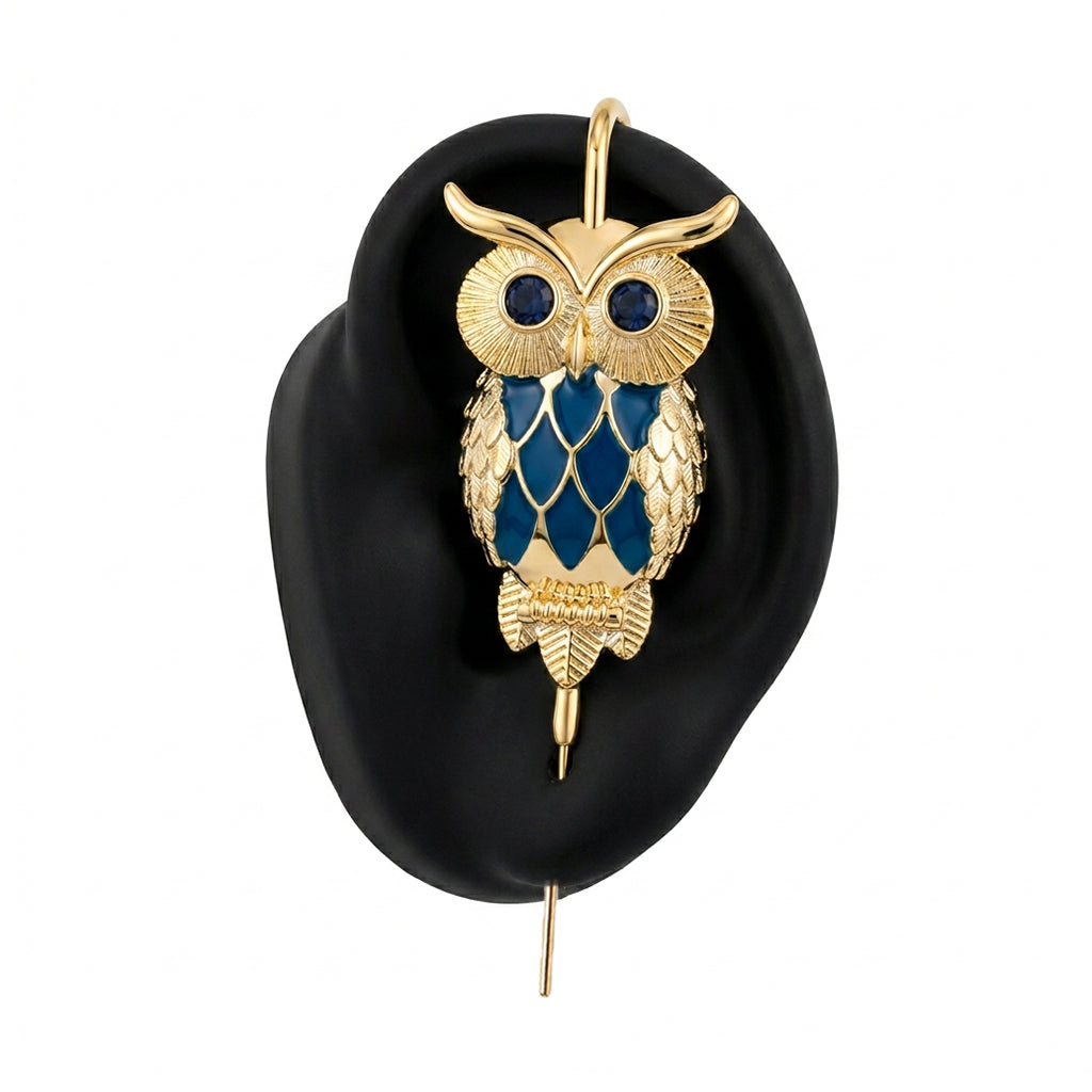 Night Owl ear cuff in gold on a black ear form