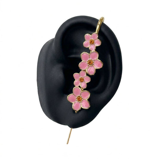 Cherry Blossom ear cuff in gold on a black ear form