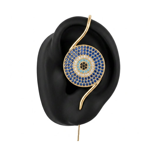 Evil Eye ear cuff in gold on a black ear form