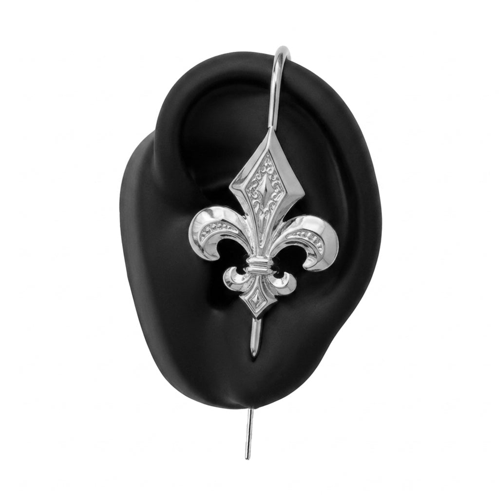 Fleur De Lys ear cuff in silver on a black ear form