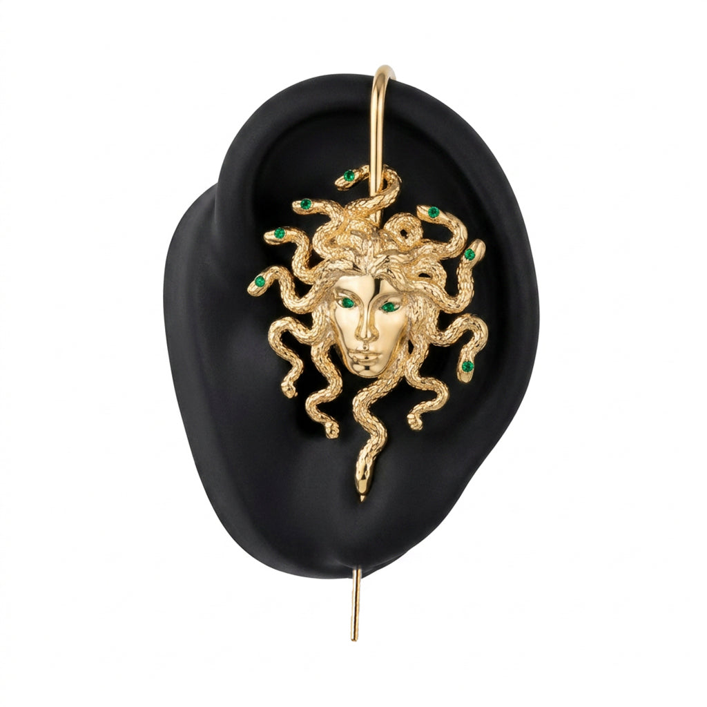 Medusa's Gaze ear cuff in gold on a black ear form