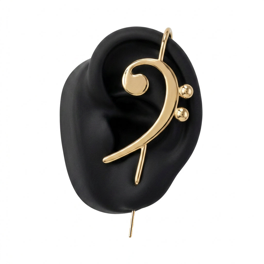 Bass Clef ear cuff in gold on a black ear form