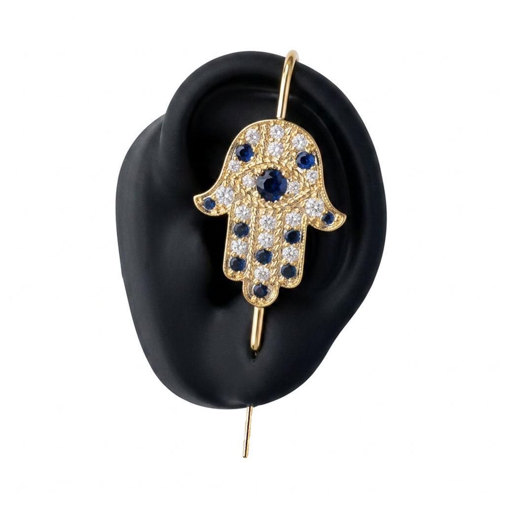 Hamsa ear cuff in gold on a black ear form