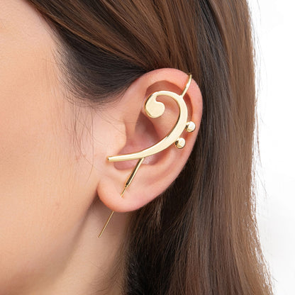 Bass Clef ear cuff in gold on a black ear form