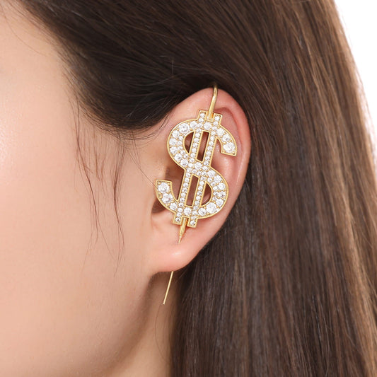 CA$H ear cuff worn on the ear, profile view