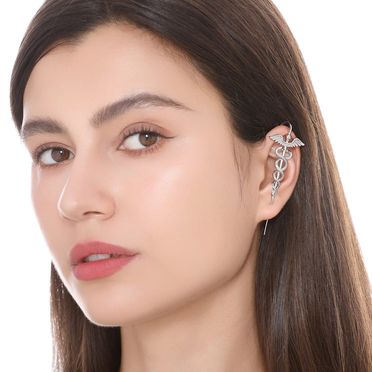 Caduceus ear cuff worn on the ear, profile view