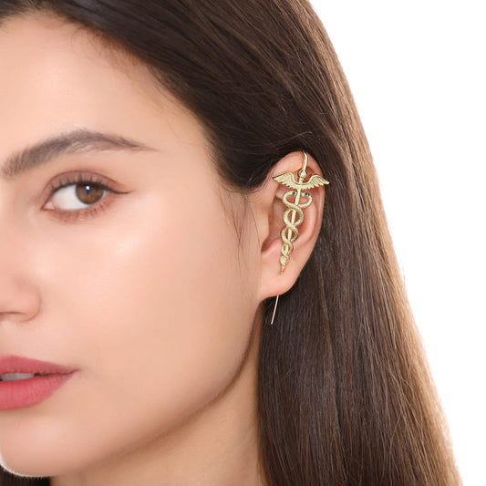 Caduceus ear cuff worn on the ear, profile view
