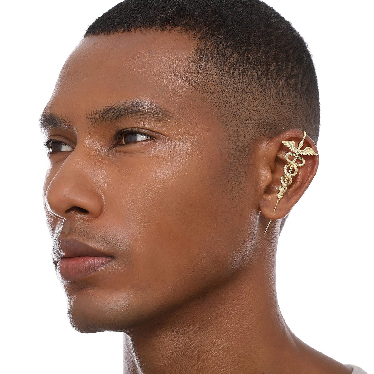 Caduceus ear cuff worn on the ear, profile view