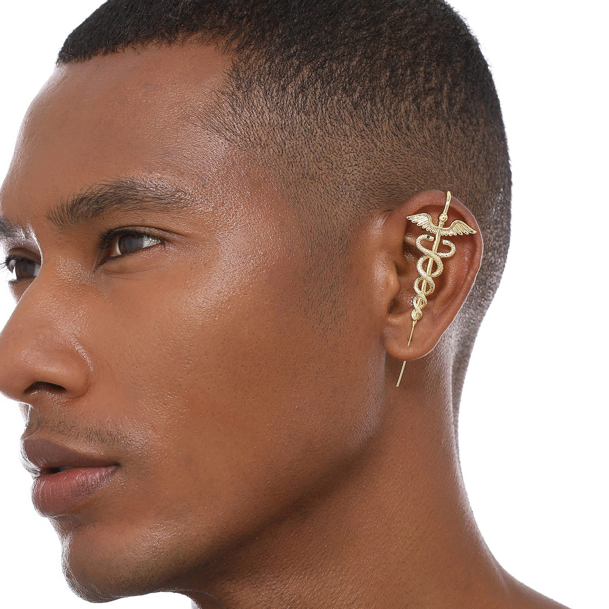 Caduceus ear cuff worn on the ear, profile view