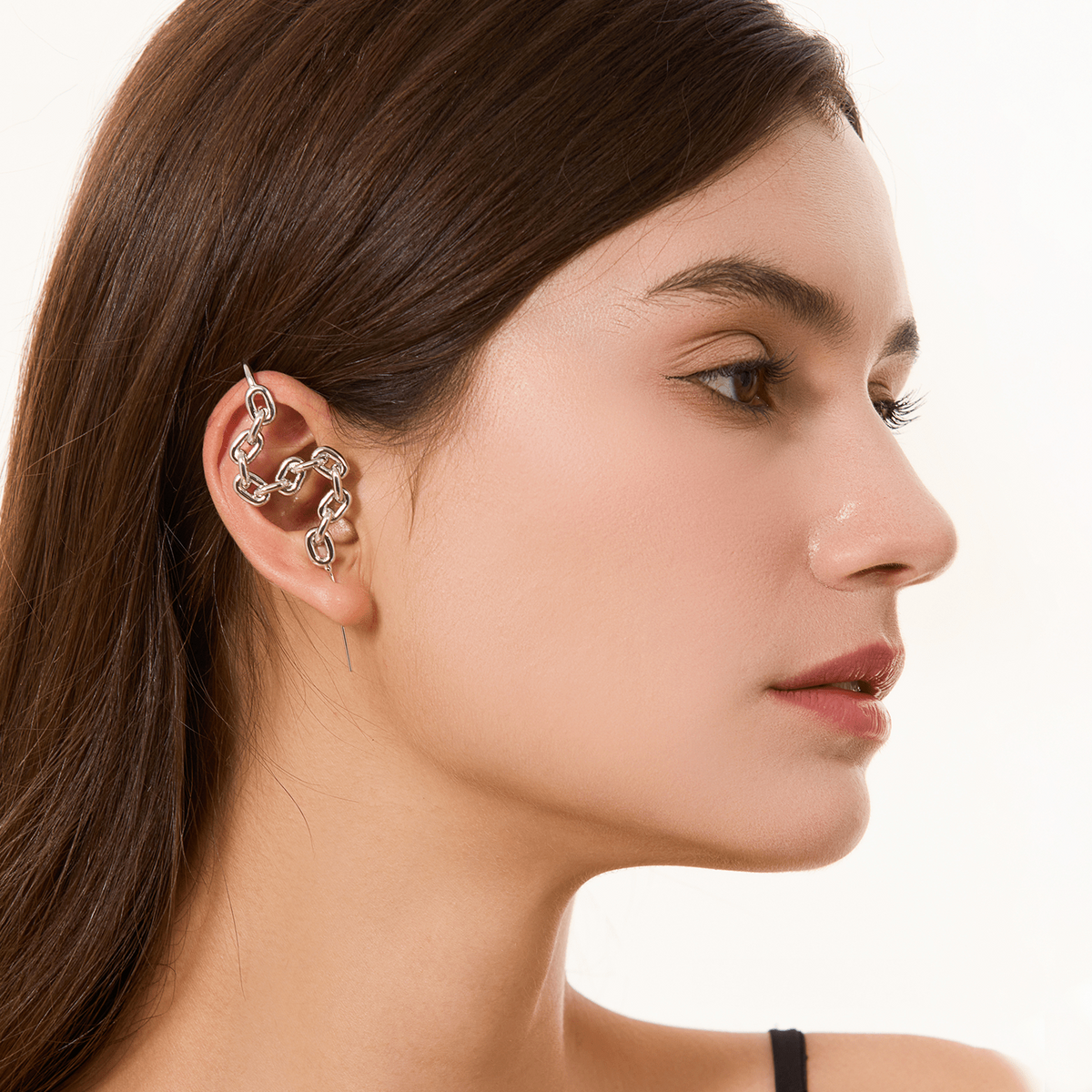 Chain-Link ear cuff in silver worn on the ear, profile view