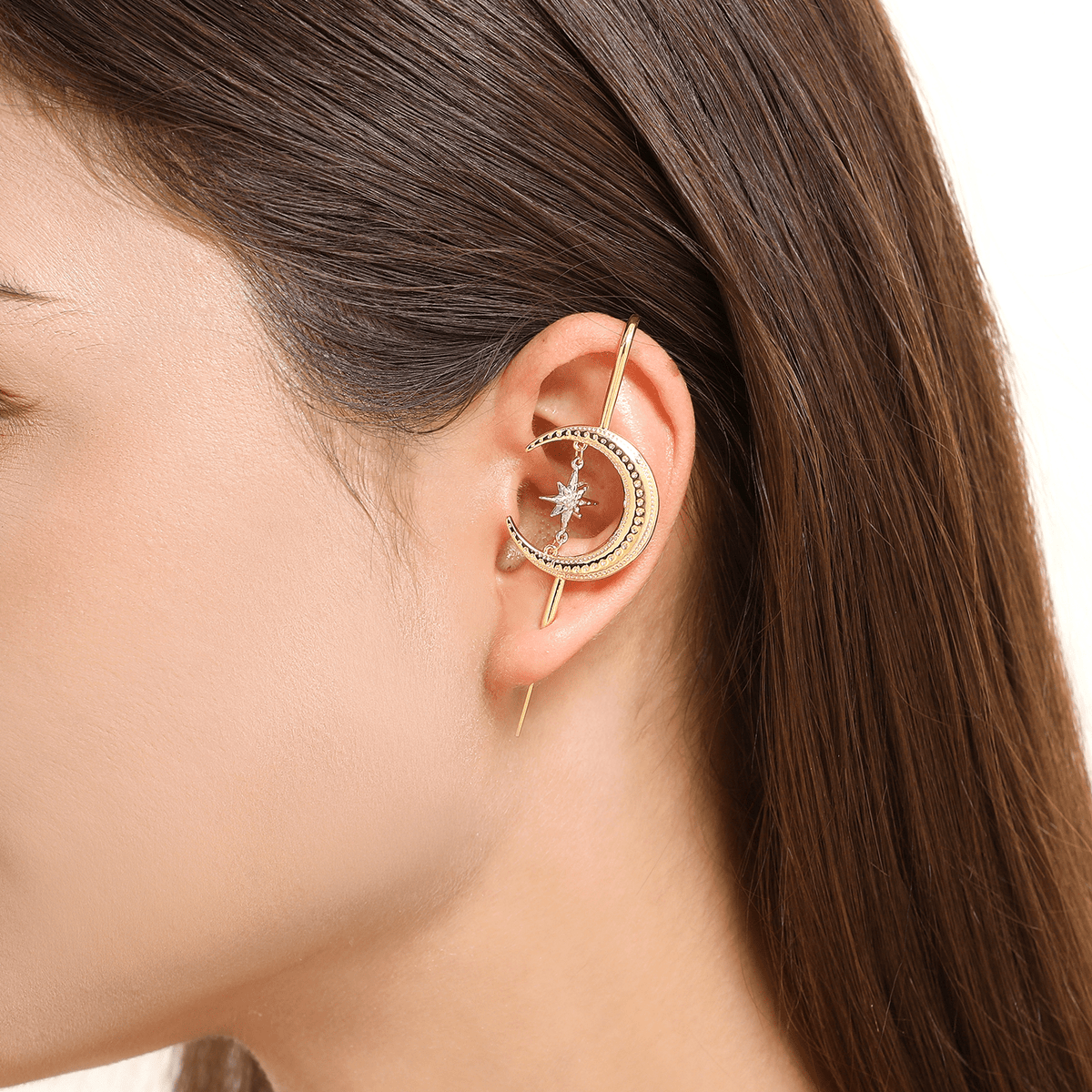 Cosmic Connection ear cuff in gold worn on the ear, profile view
