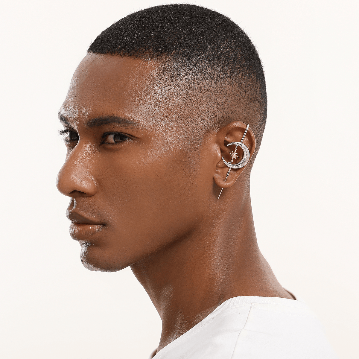 Cosmic Connection ear cuff in silver worn on the ear, profile view