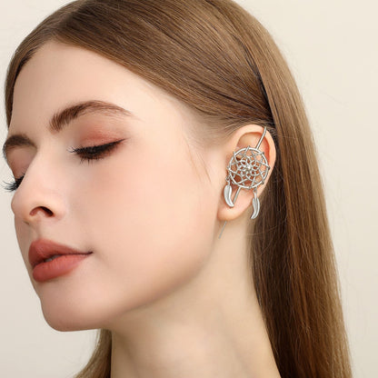 Dreamcatcher ear cuff worn on the ear, profile view