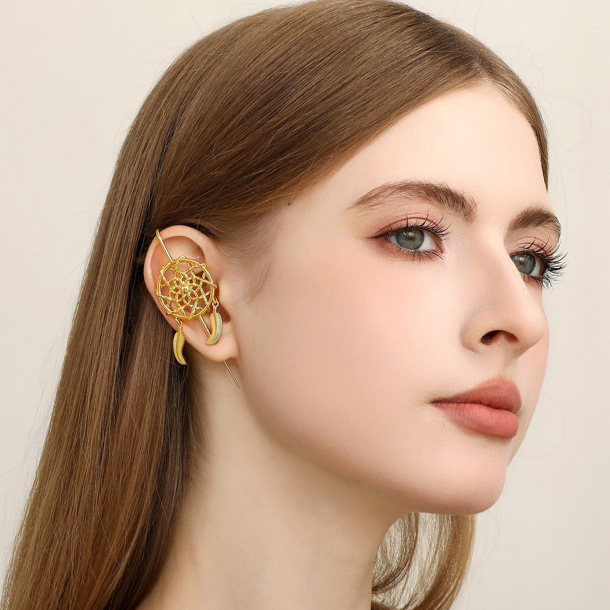 Dreamcatcher ear cuff worn on the ear, profile view