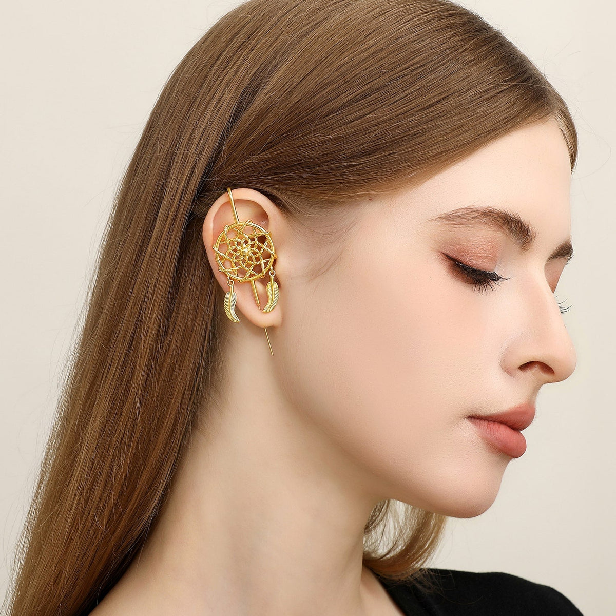 Dreamcatcher ear cuff worn on the ear, profile view