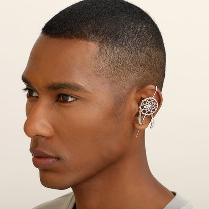 Dreamcatcher ear cuff worn on the ear, profile view