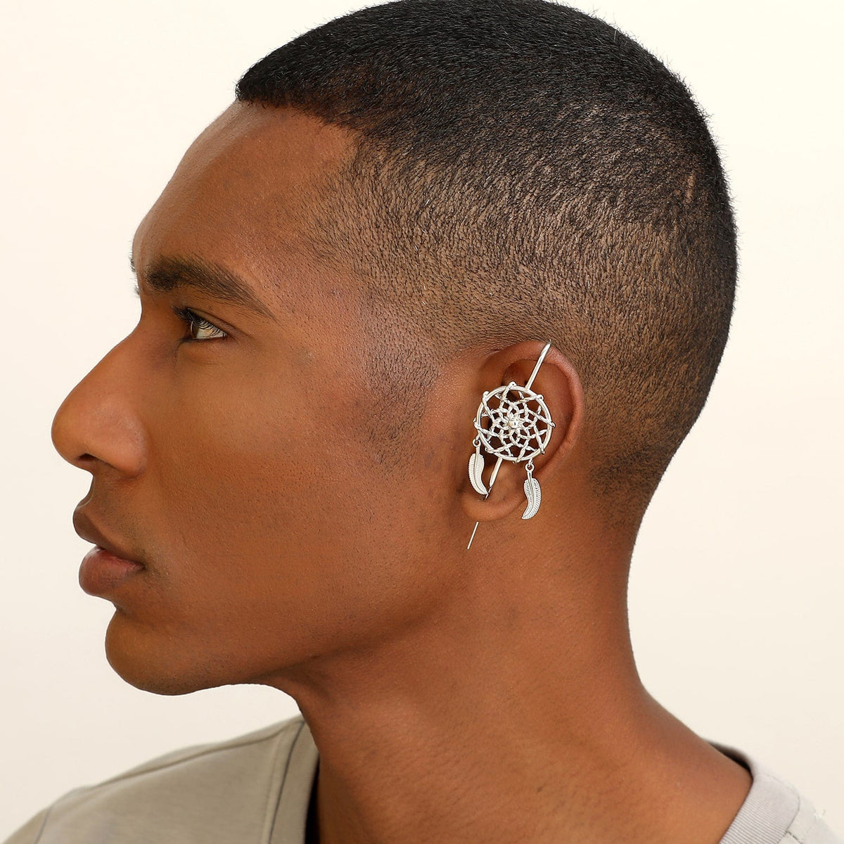 Dreamcatcher ear cuff worn on the ear, profile view