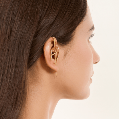 Elevate ear cuff in gold worn on the ear, profile view