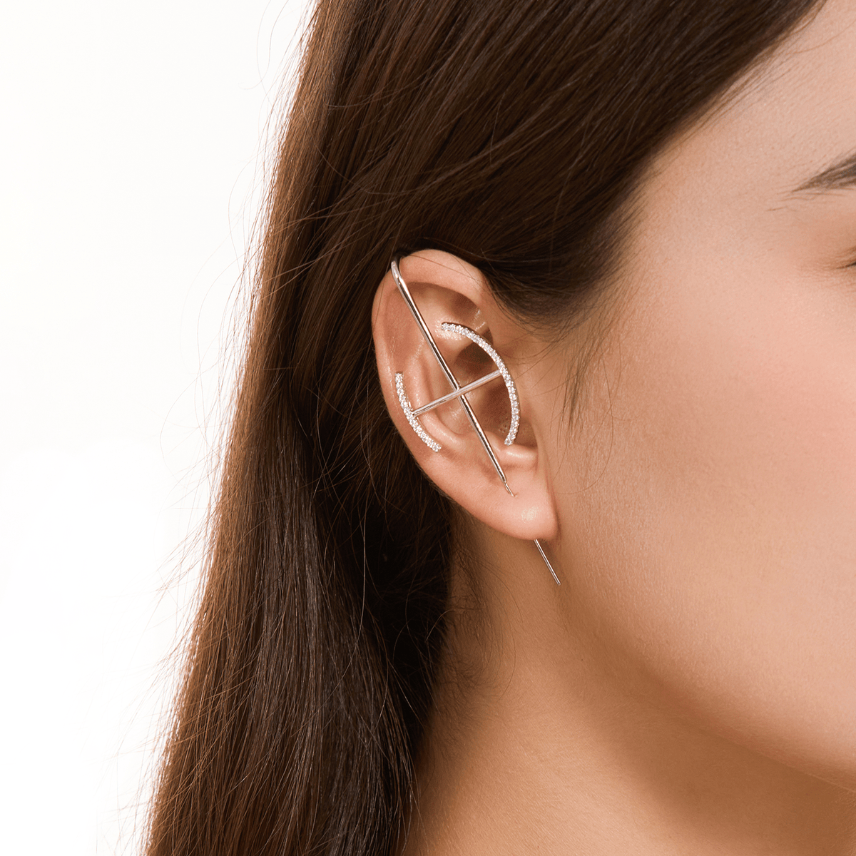 Elevate ear cuff in silver worn on the ear, profile view