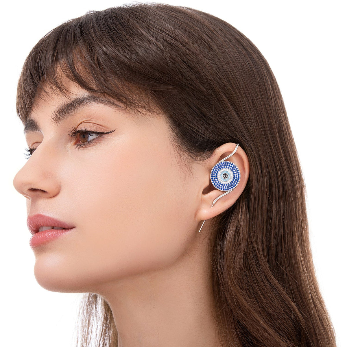Evil Eye ear cuff worn on the ear, profile view