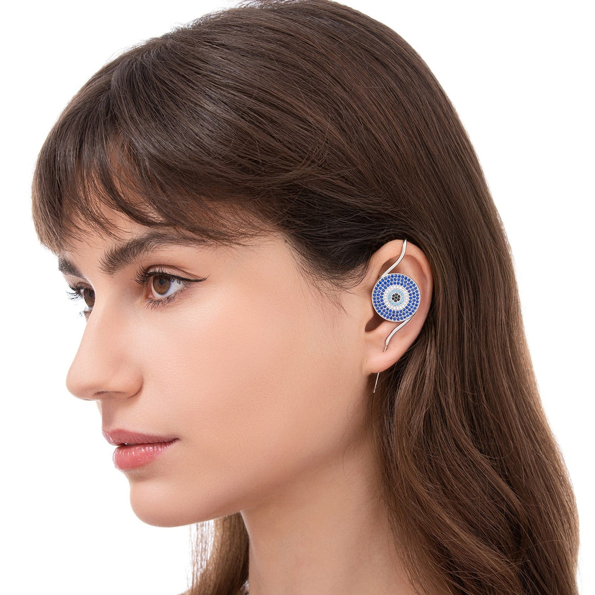 Evil Eye ear cuff worn on the ear, profile view