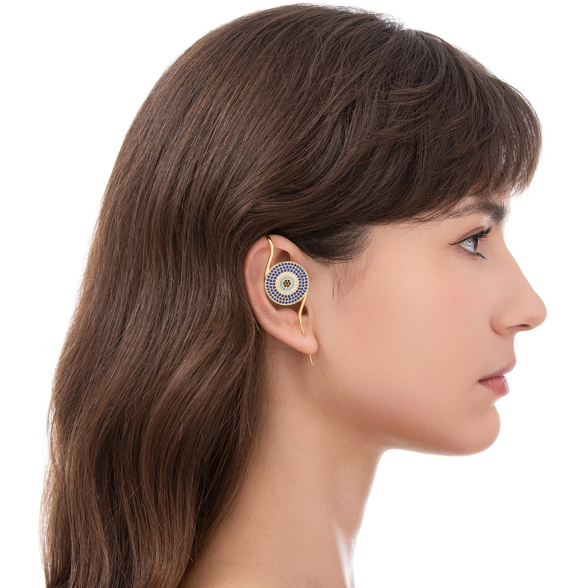 Evil Eye ear cuff worn on the ear, profile view