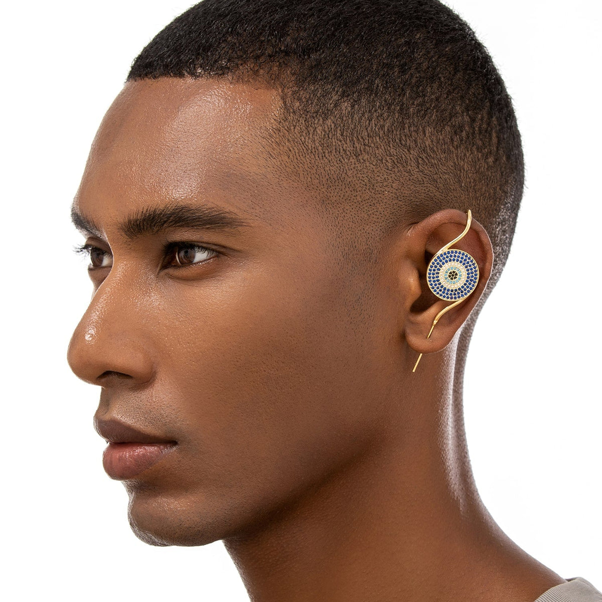 Evil Eye ear cuff worn on the ear, profile view