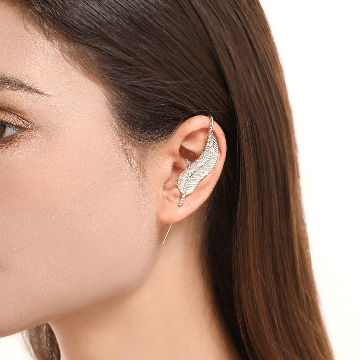 Feathered Grace ear cuff in silver worn on the ear, profile view