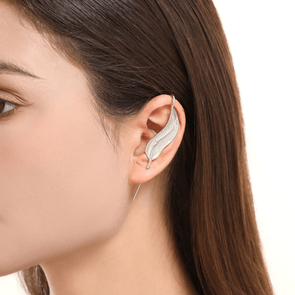 Feathered Grace ear cuff in silver worn on the ear, profile view