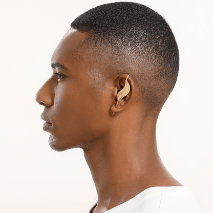 Feathered Grace ear cuff in gold worn on the ear, profile view